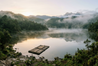 El Dorado origin site showing a misty Andean lake with a wooden raft near the shore
