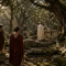 Roman sacred forests with a priest and worshippers beside an ancient grove